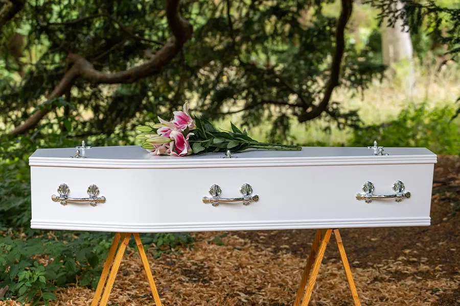Coffin with a coloured painted finish